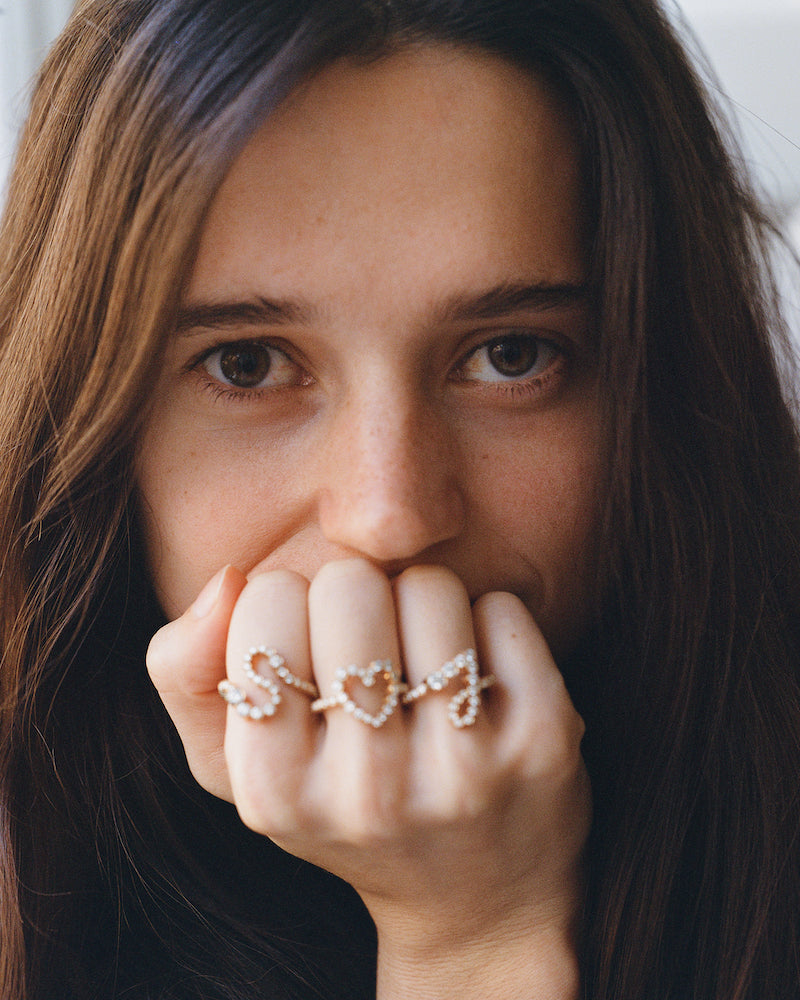 Isaure Chaudun wearing Ensemble S & J with Ensemble Coeur rings.