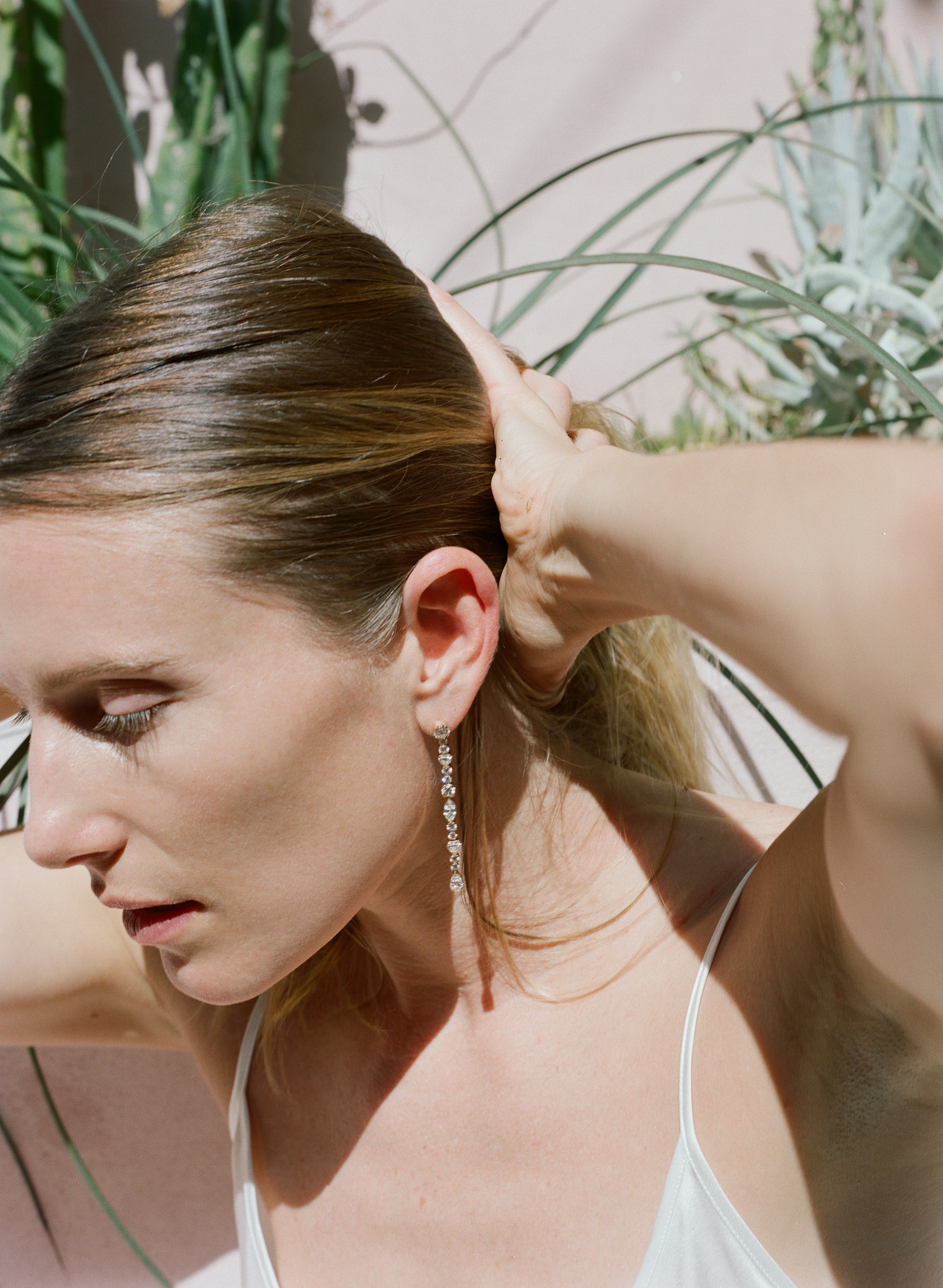 Dree Hemingway wearing Amis de la Reine long diamond earrings.
