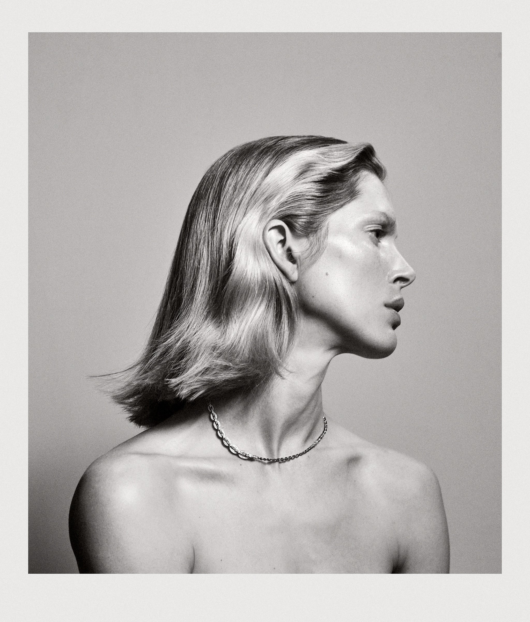 Black and white photo, model wearing Santa Fe necklace