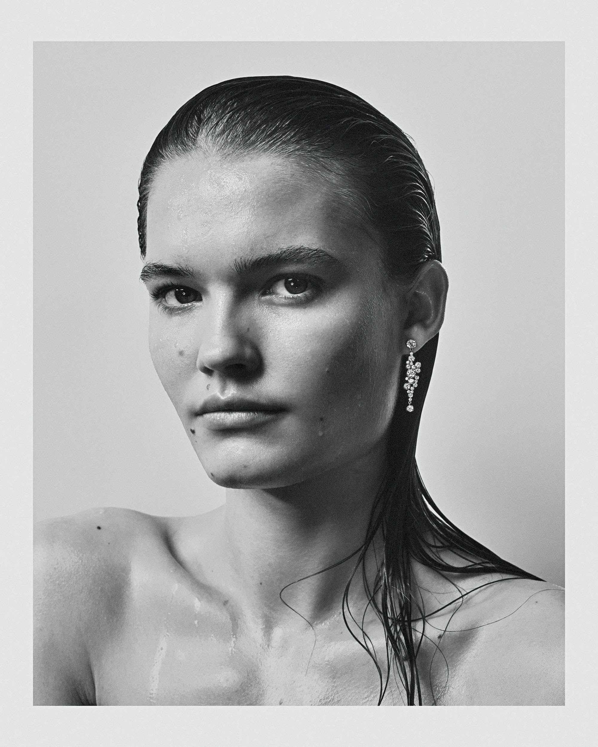 Model wearing Splash Bleu diamond earring