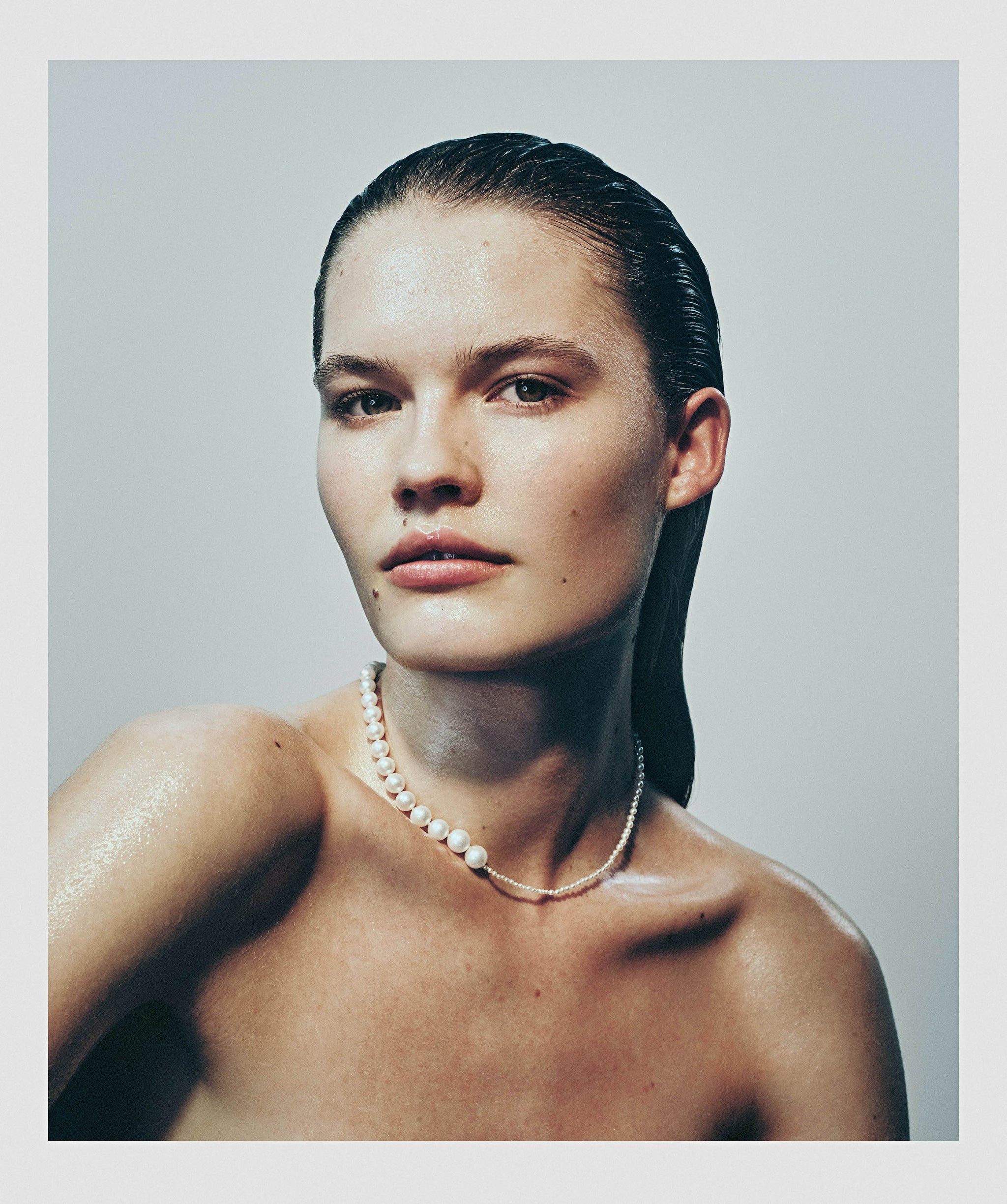 Model wearing Peggy pearl necklace