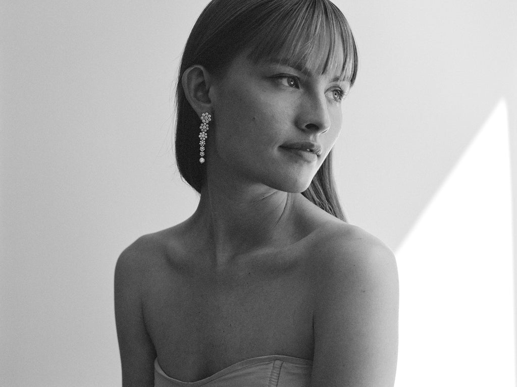Model wearing the Fontaine de Fleurs diamond earrings