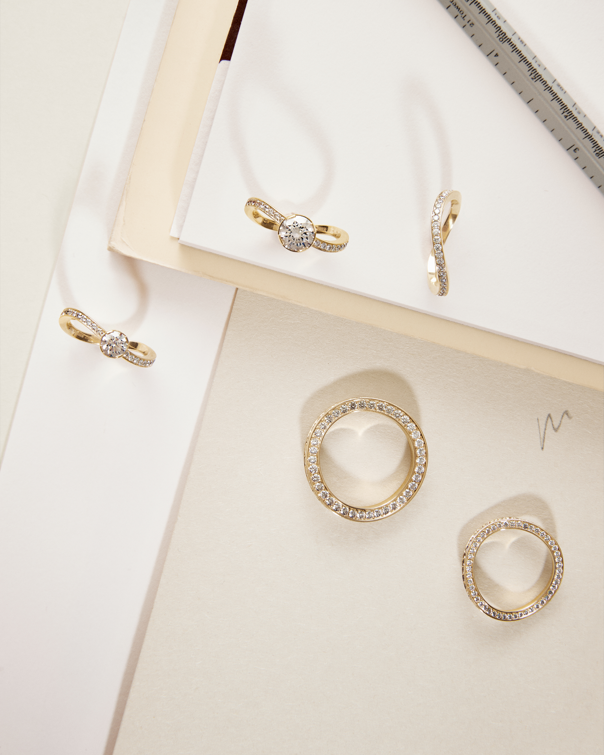 Selection of engagement rings and wedding bands, all handmade in 18K recycled gold.