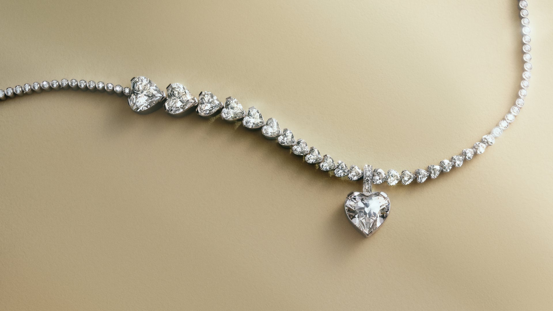 Sky 4 diamond necklace with heart-shaped pendant on a beige background