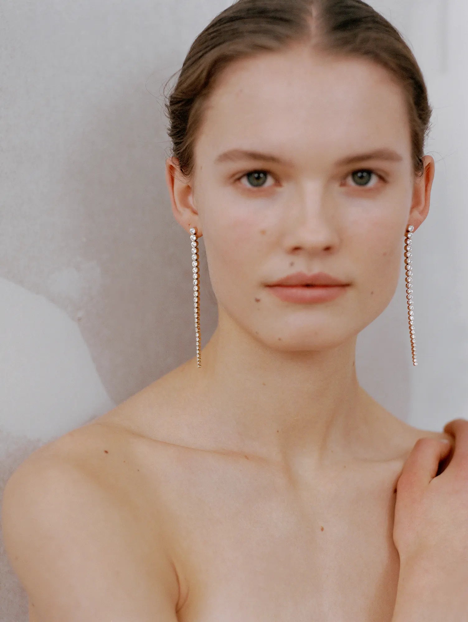 Model wearing Sandro Grande diamond earrings