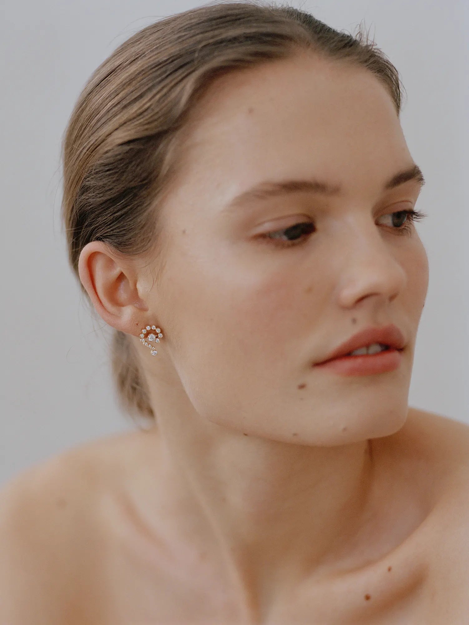 Model wearing Petite Escargot earring