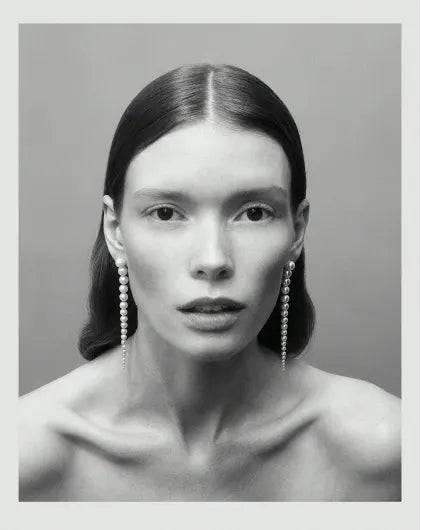 Black and white photo of model wearing Sienna Grande pearl earrings