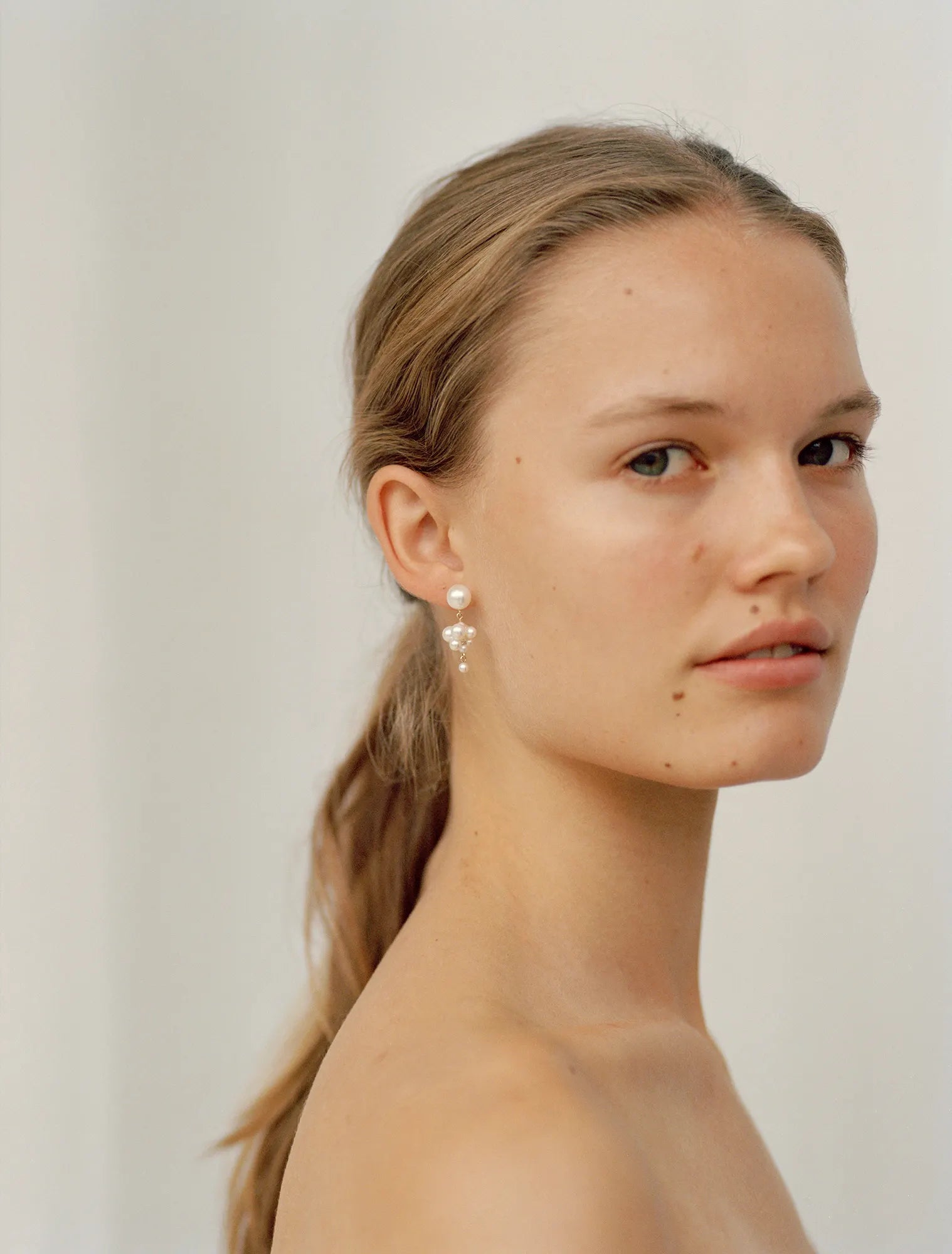 Model wearing Petite Celli earring